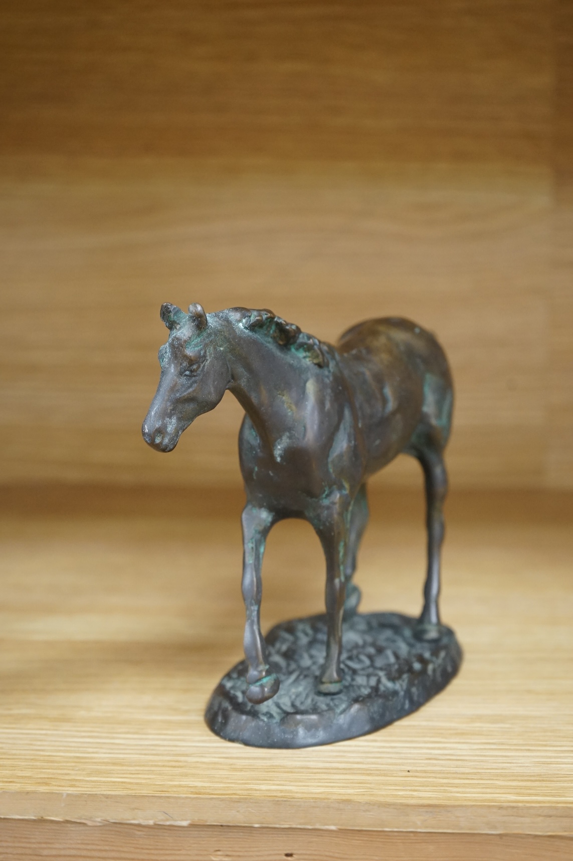 A bronze model of a horse, 23cm wide